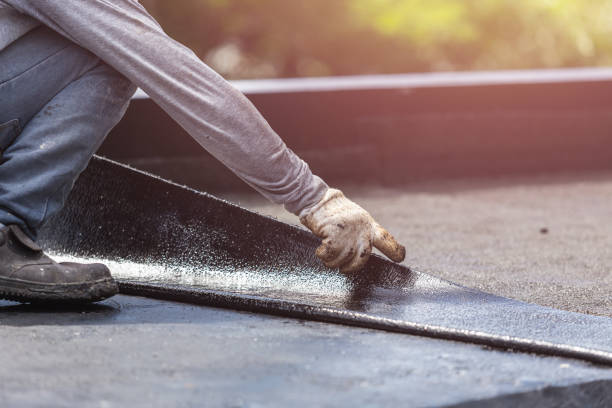 Professional Basement Waterproofing technician working in Reston, VA